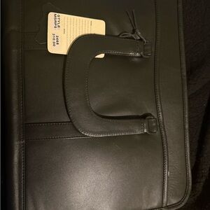 Black Leather Briefcase with Structured Design and Metal Hardware